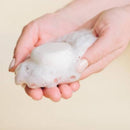 Close-up of TCB Men's Daily Shampoo texture, showcasing its lightweight, lathering formula for easy application.
