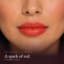 Model wearing Sheer Gloss Lipstick - Fire Cracker Red