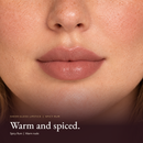 Model wearing Sheer Gloss Lipstick - Spicy Rum