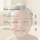 Bath-time routine: wash, shampoo with a little Baby Shampoo, then moisturize, over a smiling baby with suds in curly hair