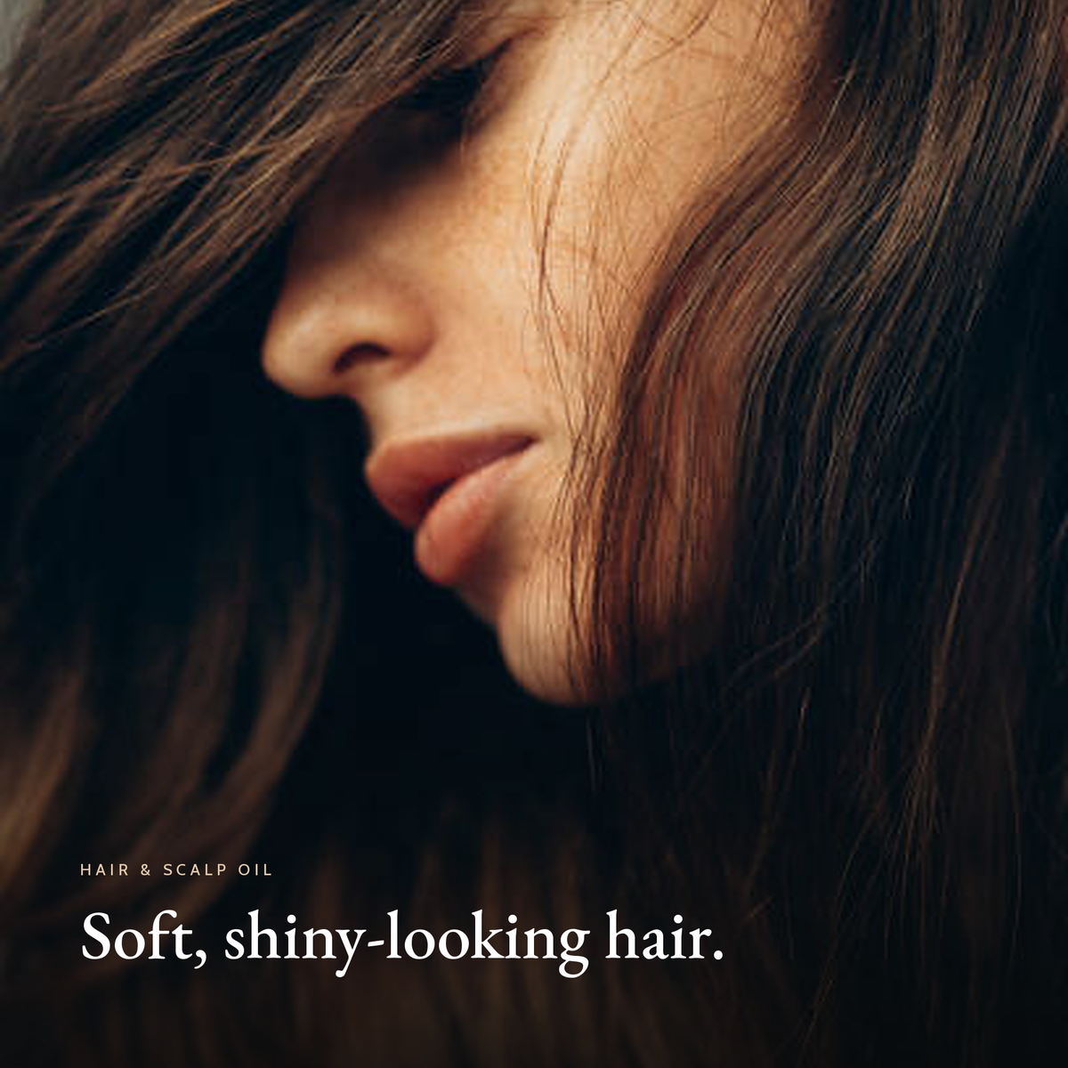 Closeup of a woman with long brown hair, soft, shiny-looking hair, Rosemary Hair & Scalp Strengthening Oil mood image