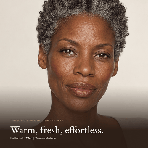 Close-up of model wearing Tinted Moisturizer in Earthy Bark